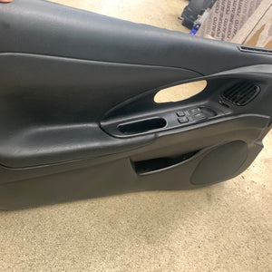 2G eclipse black drivers side door panel. 1999