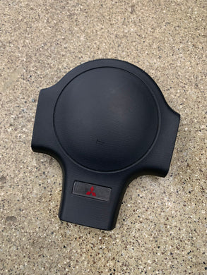 1g 90-94 Mitsubishi steering wheel horn pad.