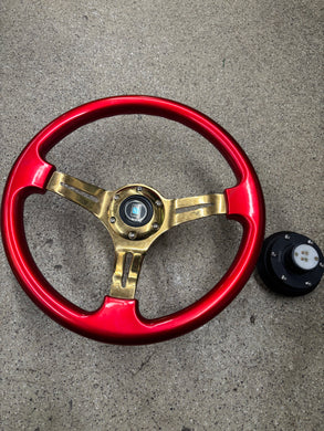 Candy Red Nardi 14 inch steering wheel with NRG quick release.
