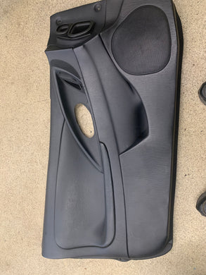 2G eclipse black drivers side door panel. 1999