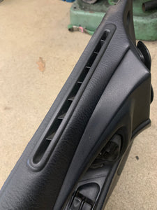 2G eclipse black drivers side door panel. 1999