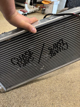 Load image into Gallery viewer, Chase bays tucked aluminum Radiator setup with the an lines.